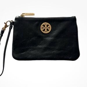 Tory Burch Wristlet Clutch. It has 3 main zip pockets and 2 credit card pockets!
